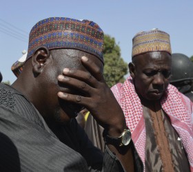 Man weeps as he joins parents of kidnapped school girls during a meeting with the Borno State governor in Chibok