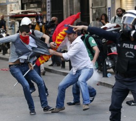 Police detain a protester during a demonstration to blame the government for the mining disaster, in Istanbul