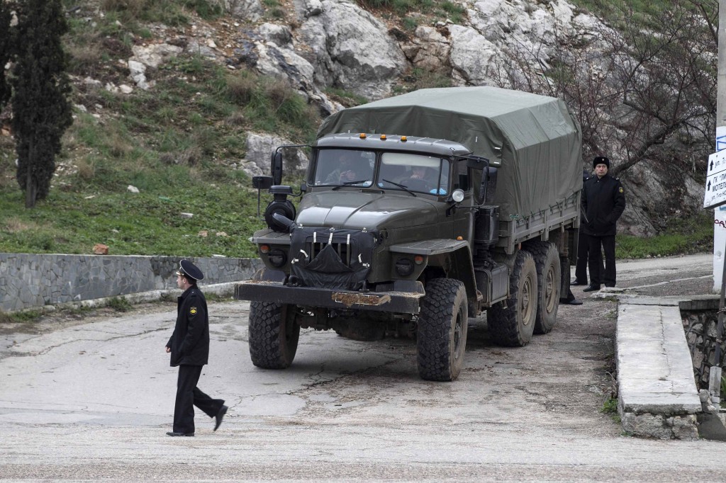 Armed Russian navy servicemen surround a Ukrainian border guard base in Balaclava, in the Crimea region