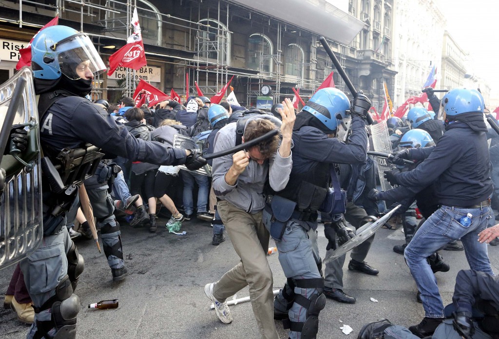 Demonstrators clash with policemen during a protest against austerity measures in downtown Rome
