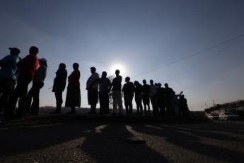 Voters queue to cast their ballots in Johannesburg's Alexandra township