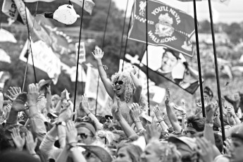 Festival goers watch Dolly Parton perform on the Pyramid Stage at Worthy Farm in Somerset, during the Glastonbury Festival