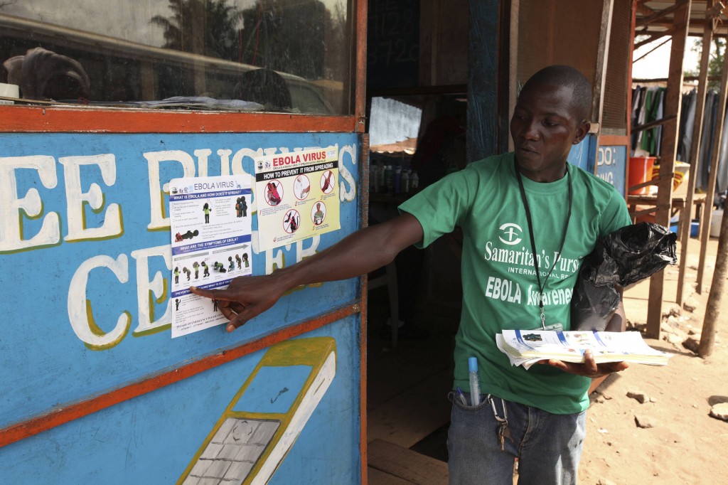 A Samaritan's Purse team member hands out pamphlets to educate the public on the Ebola virus in Monrovia in this undated handout photo