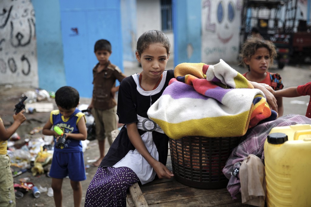 Palestinian children gather outside a United Nations-run school in the northern Gaza Strip