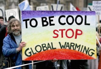 A protester holds a banner during a demonstration against climate change in central London