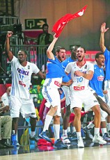 France's players celebrate victory during their Basketball World Cup quarter-final game against Spain in Madrid